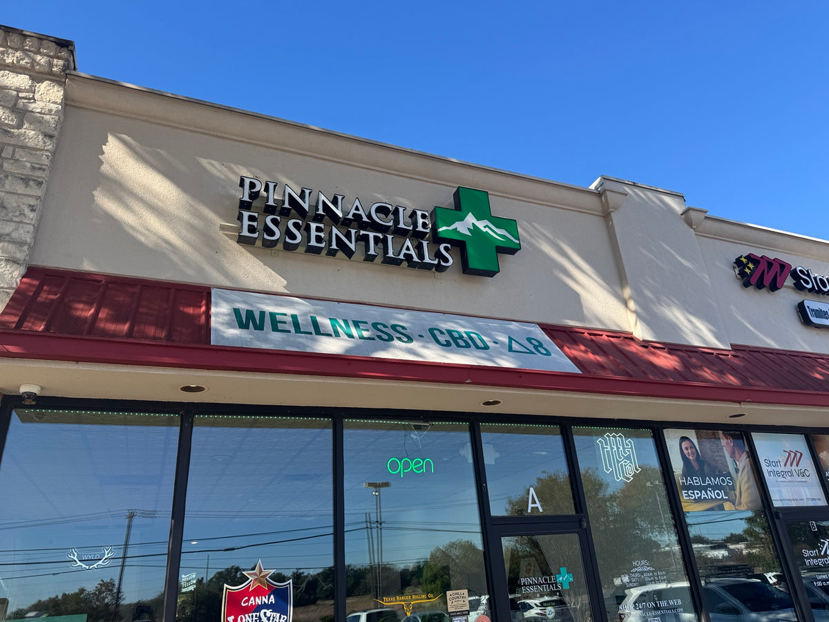 Pinnacle Essentials storefront with branded awning
