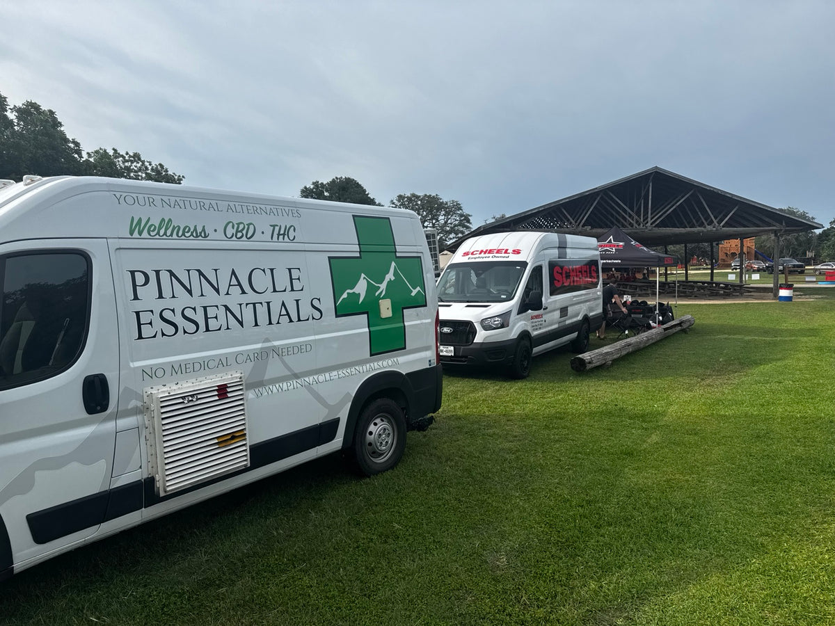 Pinnacle Essentials van on the lawn at an outdoor event