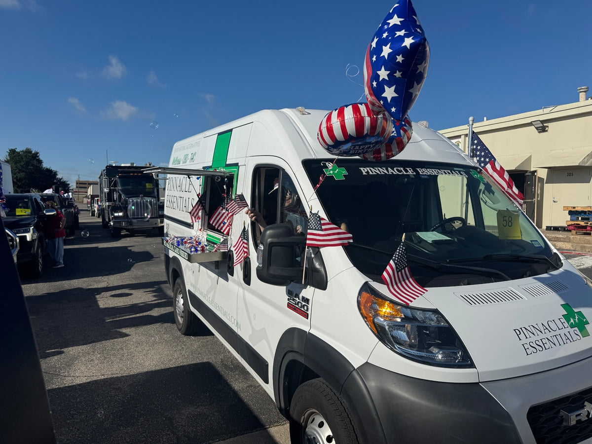 Pinnacle Essentials van decorated with American flags