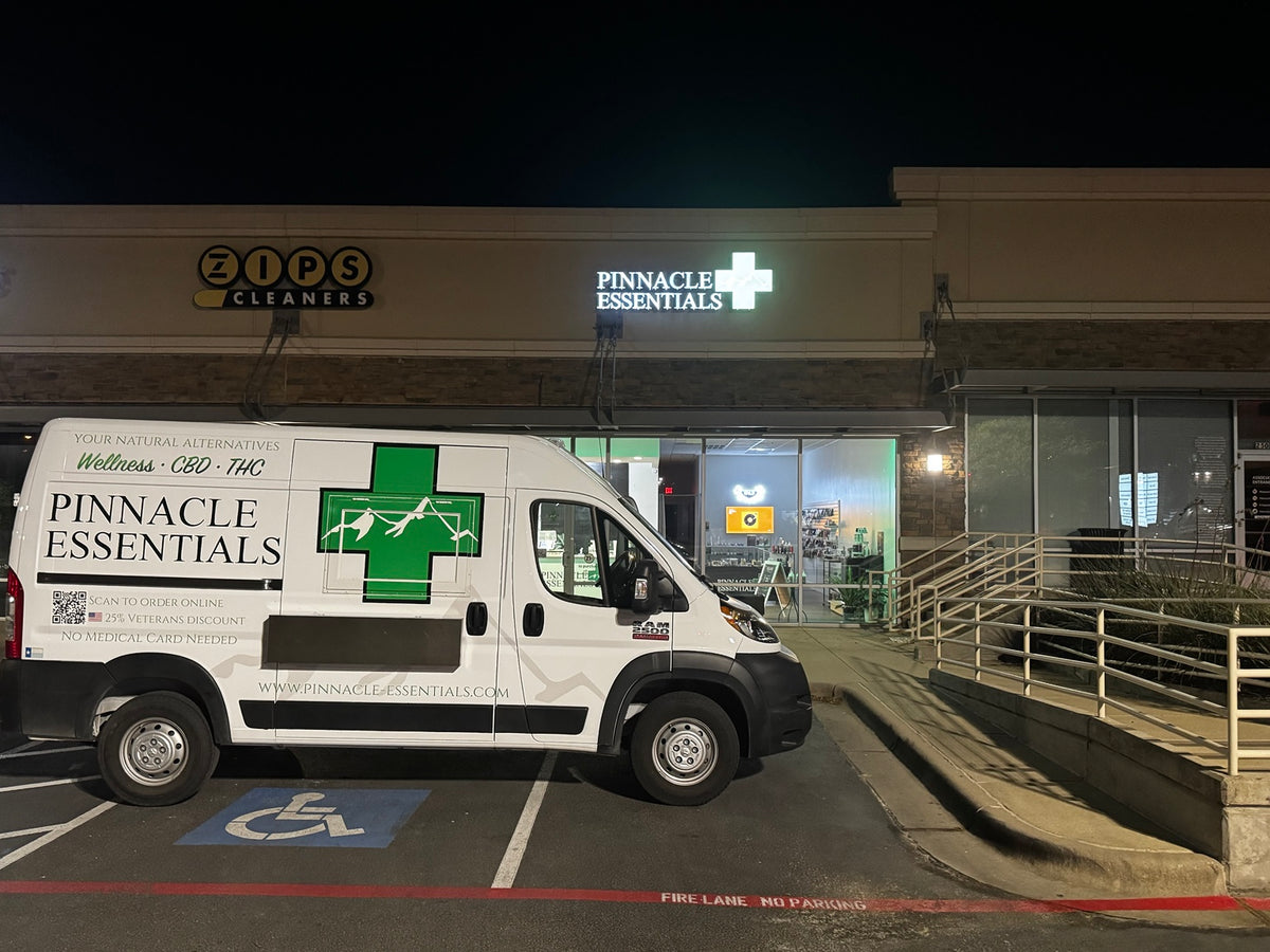 Pinnacle Essentials van outside a store at night