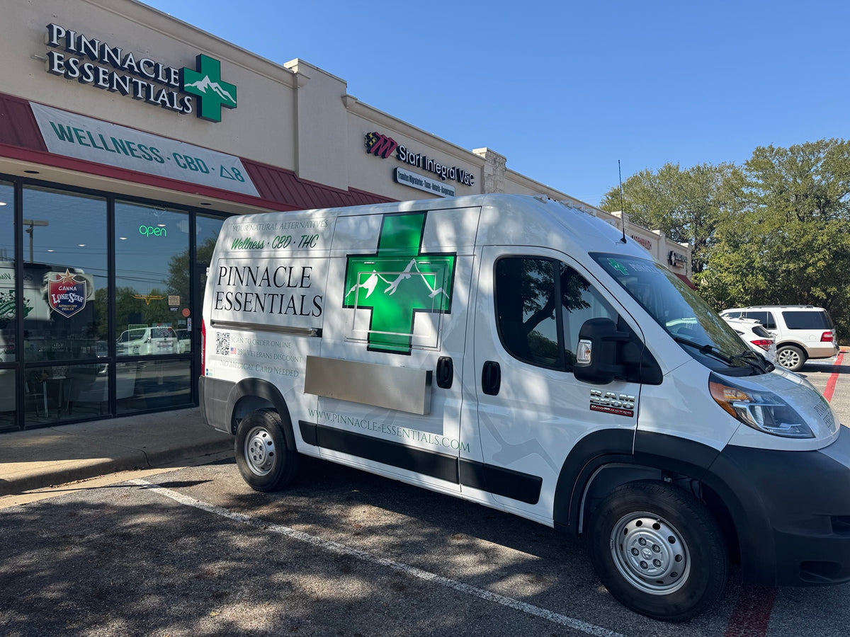Pinnacle Essentials van parked outside a retail store